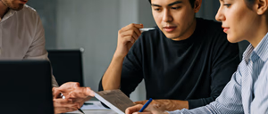 Team of marketing professionals analyzing data in a bright modern office