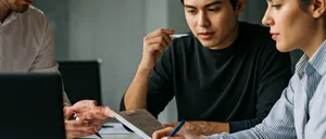 Team of marketing professionals analyzing data in a bright modern office